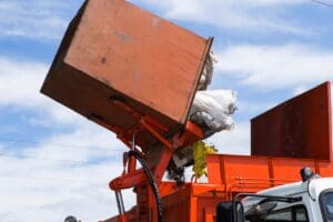 Workers,Load,Garbage,From,The,Tank,In,A,Specialized,Car
