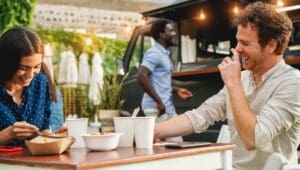 Young,People,Having,Fun,Eating,At,Food,Truck,Restaurant,Outdoor