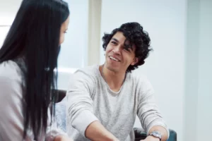 cheerful patient talking smiling 2048x1367