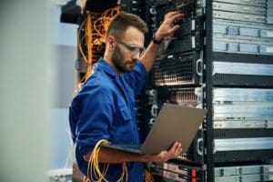 Using,The,Laptop.,Young,Man,Is,Working,With,Internet,Equipment