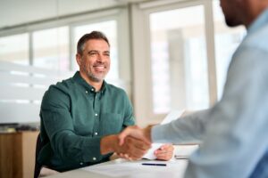 Smiling,Middle,Aged,Business,Man,Handshaking,Partner,Making,Partnership,Collaboration