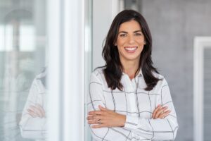 Portrait,Of,Middle,Aged,Businesswoman,In,Modern,Office,Looking,At