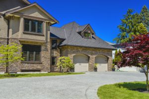 Fragment,Of,Luxury,House,With,Double,Garage,And,Concrete,Driveway