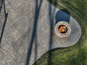 Aerial,View,Of,Round,Stone,Fire,Pit,On,Stamped,Concrete