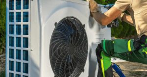 hvac worker installing electric heat pump 2022 12 16 11 50 13 utc1 1