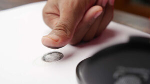 United Protection Agency person hand putting black fingerprints on a paper 2023 11 27 05 32 24 utc 1170x658